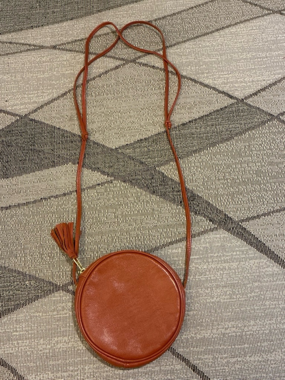 American Apparel Round Crossbody Bag in Rust Brown with Tassel